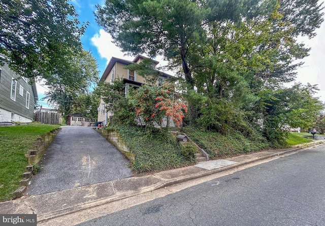 view of front of home featuring fence