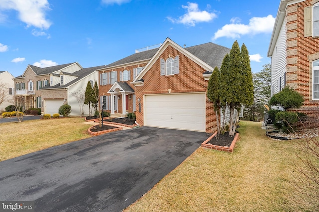 view of front of property with a shingled roof, a residential view, aphalt driveway, a front lawn, and brick siding