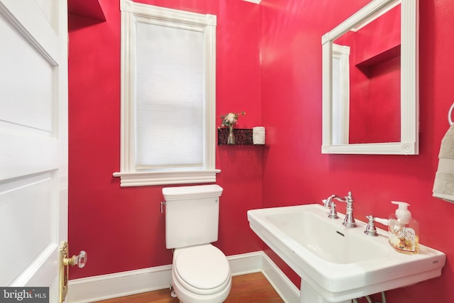 bathroom featuring sink and toilet