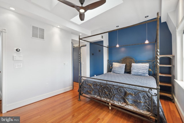 bedroom with hardwood / wood-style flooring and ceiling fan