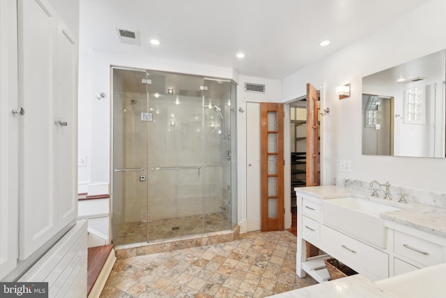 bathroom with vanity and walk in shower