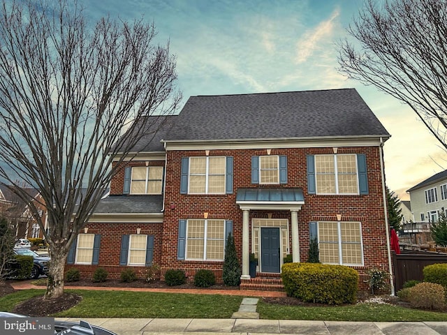 view of front of house with a lawn