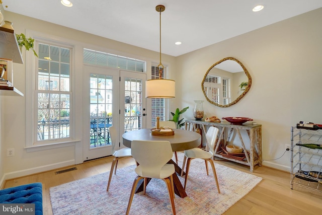 dining room with light hardwood / wood-style flooring