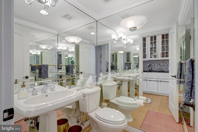 bathroom featuring sink, toilet, coffered ceiling, crown molding, and decorative backsplash