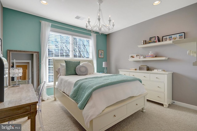 carpeted bedroom with an inviting chandelier