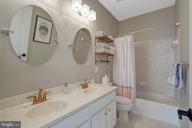 full bathroom with vanity, toilet, and shower / bath combo with shower curtain