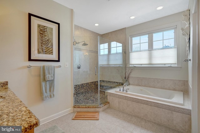 bathroom with vanity, tile patterned flooring, and independent shower and bath