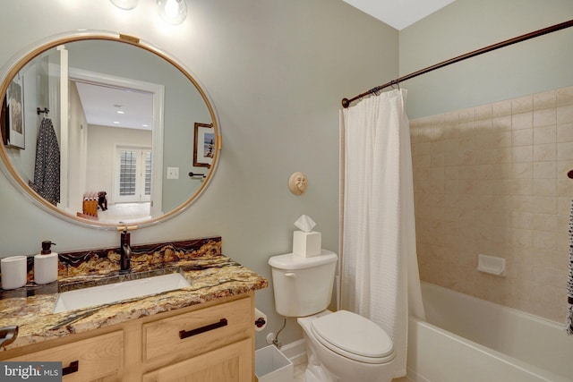 full bathroom featuring toilet, shower / bath combo, and vanity