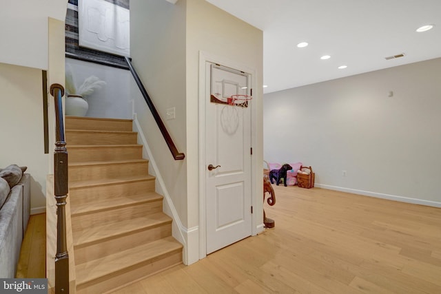 stairway featuring hardwood / wood-style floors