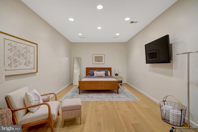 bedroom with light hardwood / wood-style flooring