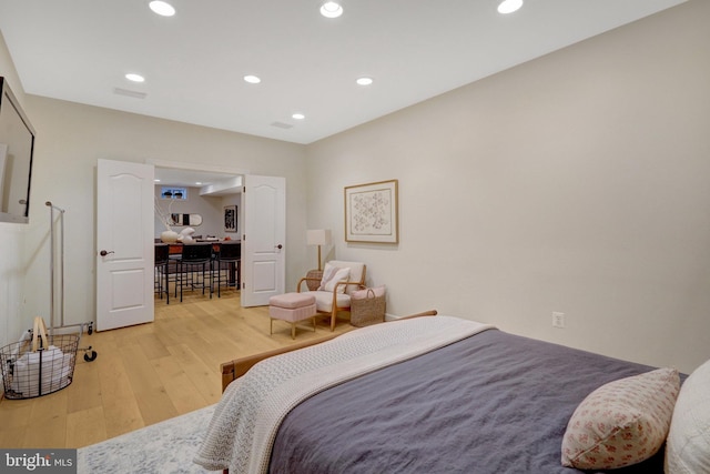 bedroom with light wood-type flooring