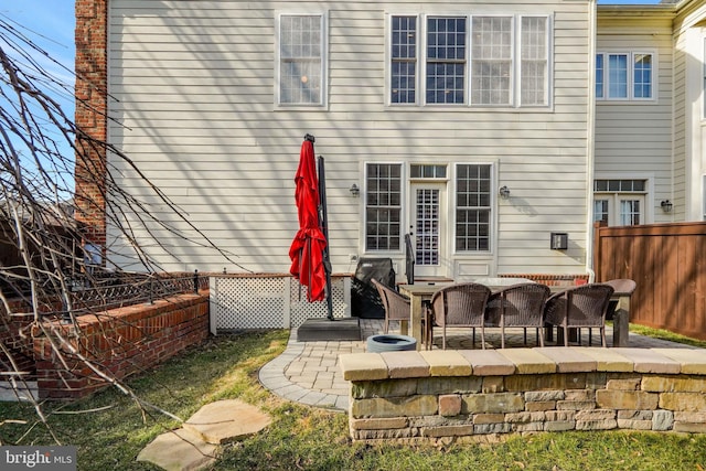 rear view of property featuring a patio