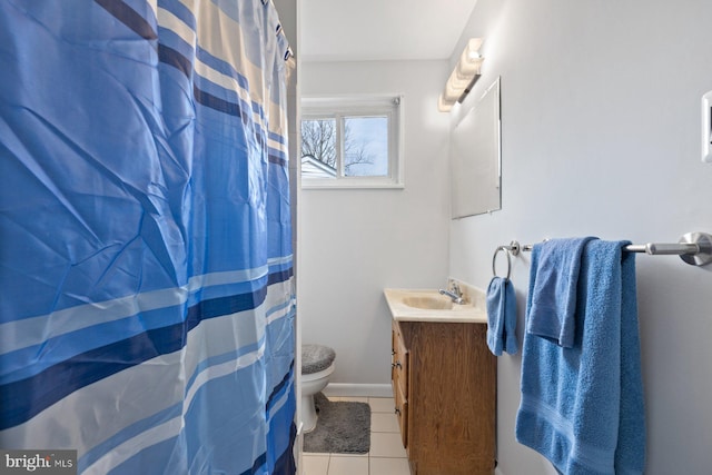 bathroom with vanity, tile patterned floors, and toilet