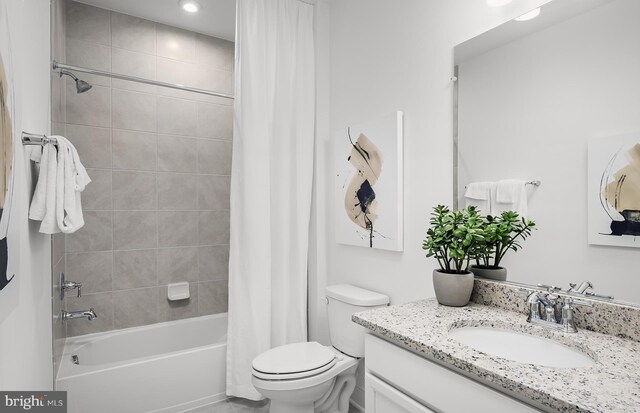 10820 Willow Ter, Fairfax, VA 22030 - full bathroom featuring vanity, shower / bath combo, and toilet