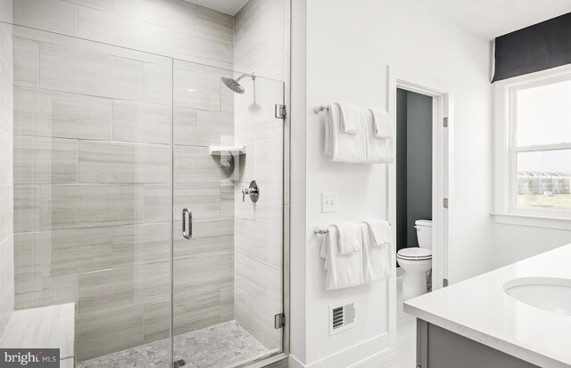 10820 Willow Ter, Fairfax, VA 22030 - bathroom featuring vanity, an enclosed shower, and toilet