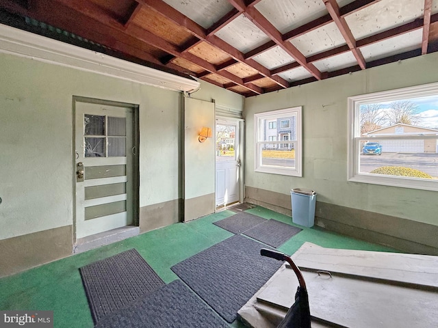 exercise room with plenty of natural light and coffered ceiling