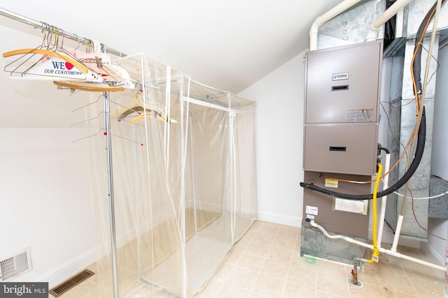 utility room with heating unit