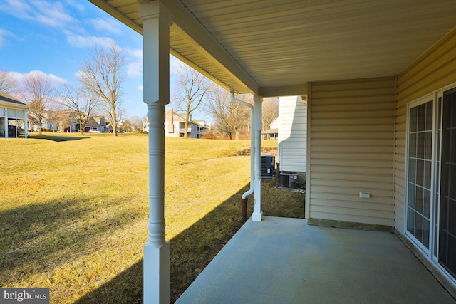 view of patio featuring cooling unit and covered porch