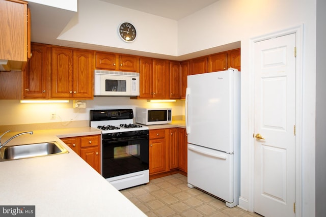 kitchen with sink and white appliances