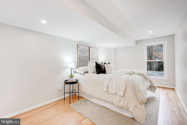 bedroom featuring baseboards, recessed lighting, and light wood-style floors