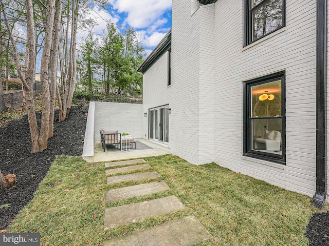 view of yard with fence and a patio