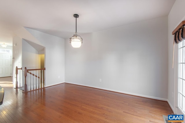 spare room with hardwood / wood-style floors