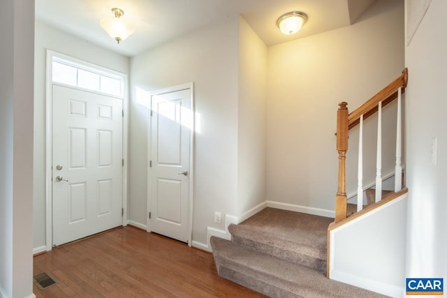 entryway with hardwood / wood-style flooring