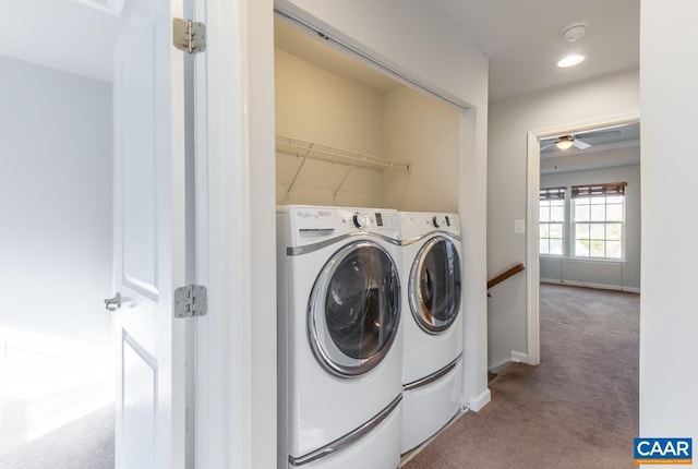 laundry area featuring ceiling fan, light colored carpet, and washing machine and dryer