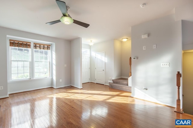 unfurnished room with ceiling fan and light hardwood / wood-style floors