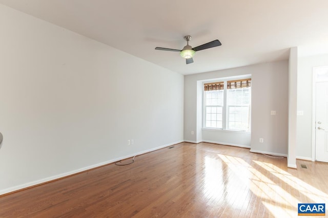 spare room with ceiling fan and light hardwood / wood-style floors