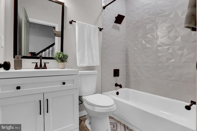 full bathroom featuring vanity, toilet, and tiled shower / bath combo