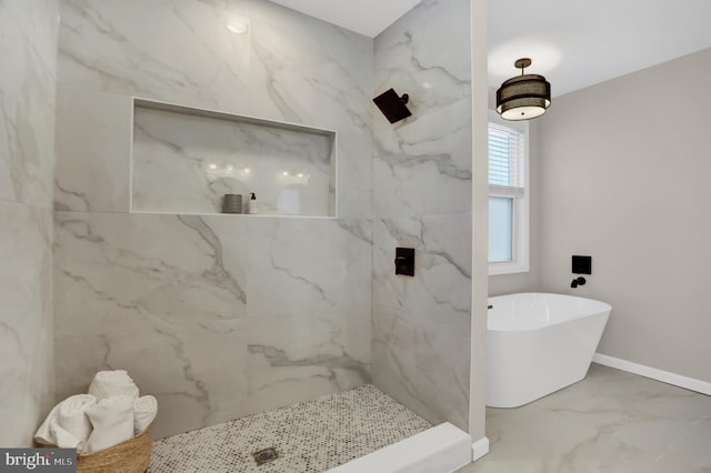 bathroom featuring shower with separate bathtub