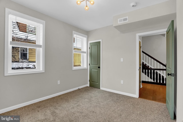 unfurnished bedroom with light carpet