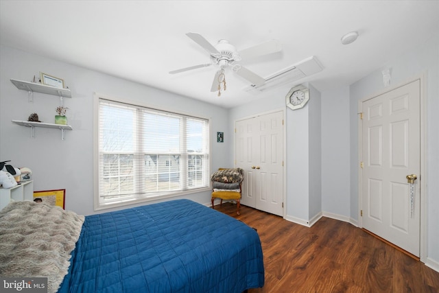 bedroom with ceiling fan, a closet, baseboards, and wood finished floors