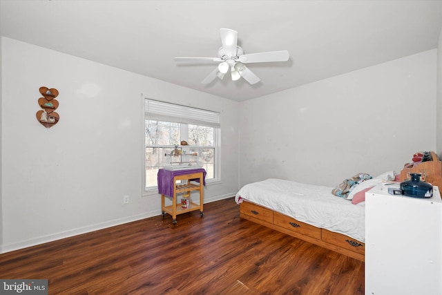 bedroom featuring ceiling fan, wood finished floors, and baseboards