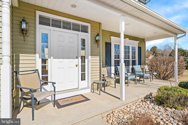 doorway to property with covered porch