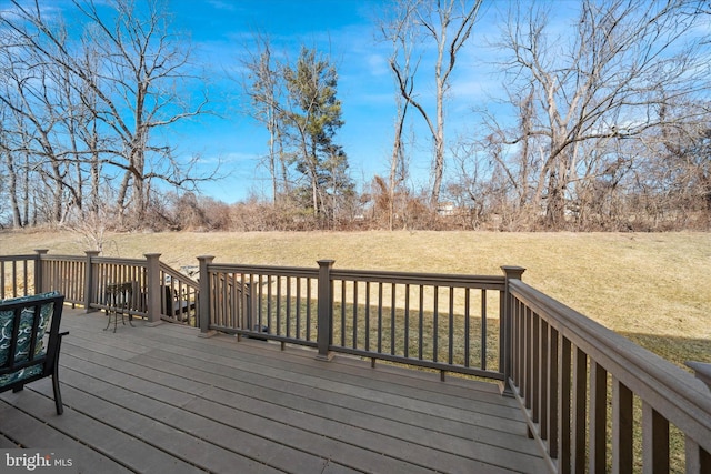 wooden terrace with a yard