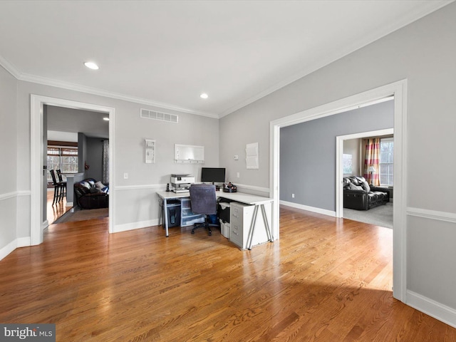 office area featuring visible vents, baseboards, ornamental molding, recessed lighting, and wood finished floors