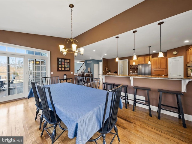 dining room featuring an inviting chandelier, recessed lighting, baseboards, and light wood finished floors
