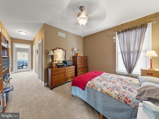 bedroom featuring a ceiling fan, baseboards, visible vents, and carpet floors