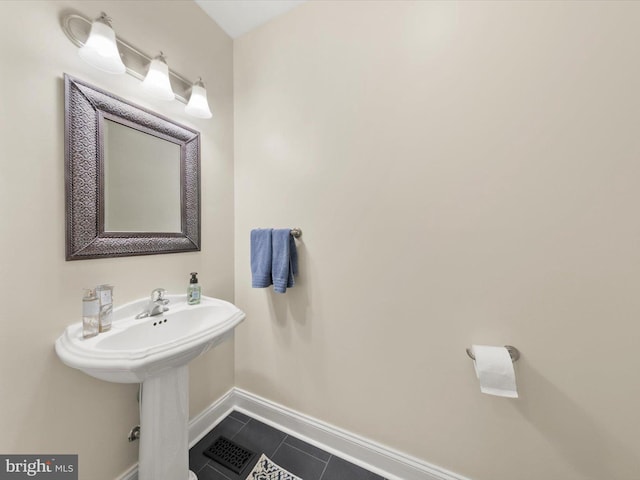 bathroom featuring tile patterned floors, visible vents, and baseboards
