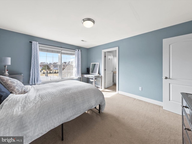 bedroom with light carpet, visible vents, and baseboards