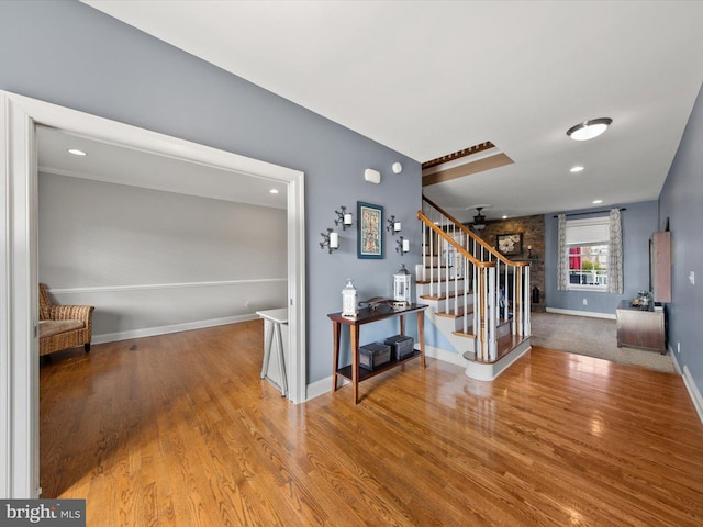 interior space featuring recessed lighting, stairway, baseboards, and wood finished floors