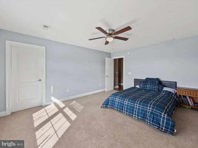 carpeted bedroom featuring a ceiling fan, baseboards, and visible vents