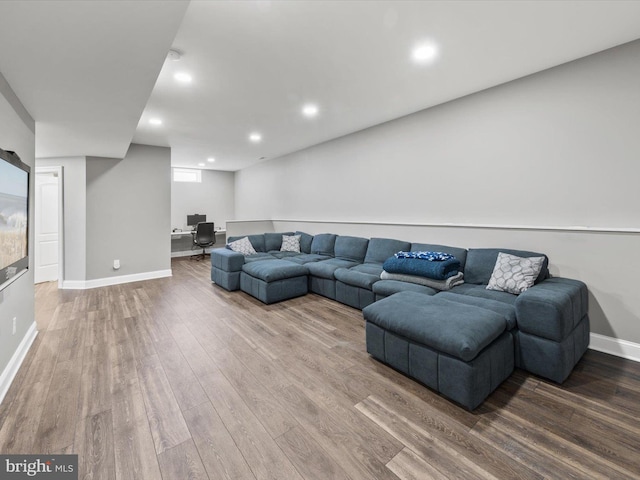 living room featuring recessed lighting, wood finished floors, and baseboards
