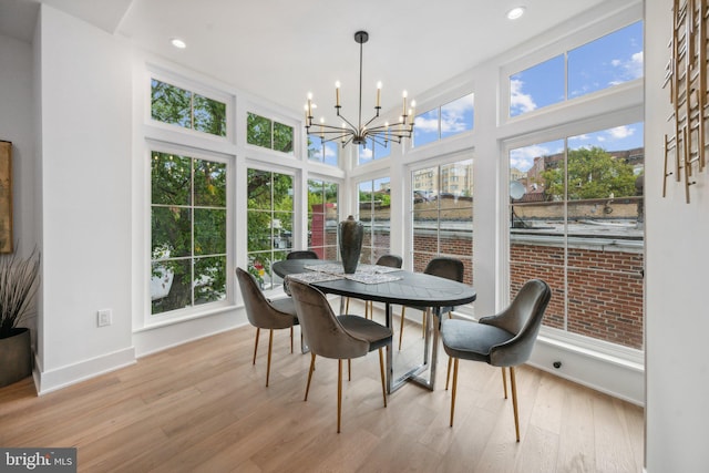 sunroom with a chandelier