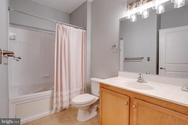 bathroom featuring shower / tub combo with curtain, vanity, toilet, and tile patterned floors