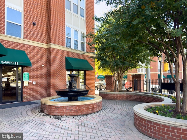 view of building exterior with fence