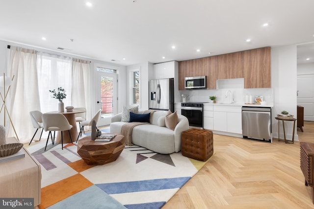 living room with recessed lighting and visible vents
