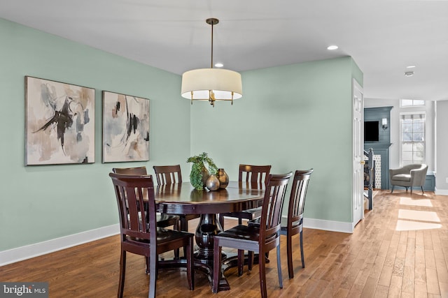 dining area featuring wood-type flooring